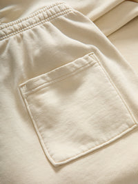 Close-up view of Pickup Organic Sweatpant in Cream, featuring a back pocket detail.