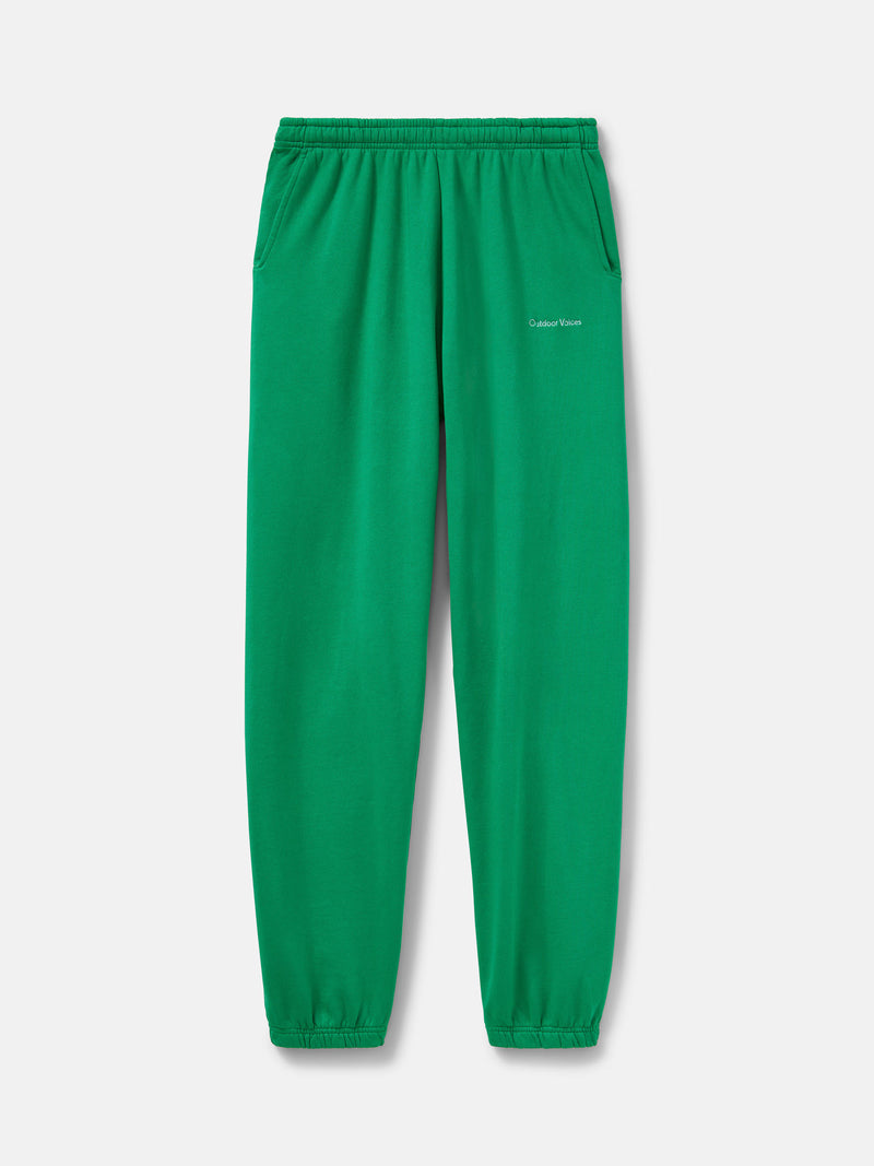 Flat lay of Pickup Organic Sweatpant in Green with elastic waistband and pockets for storage.