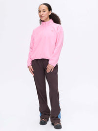 Model standing in a casual pose wearing RecFleece 1/4 Zip in Pink, featuring a front zip and soft fabric.