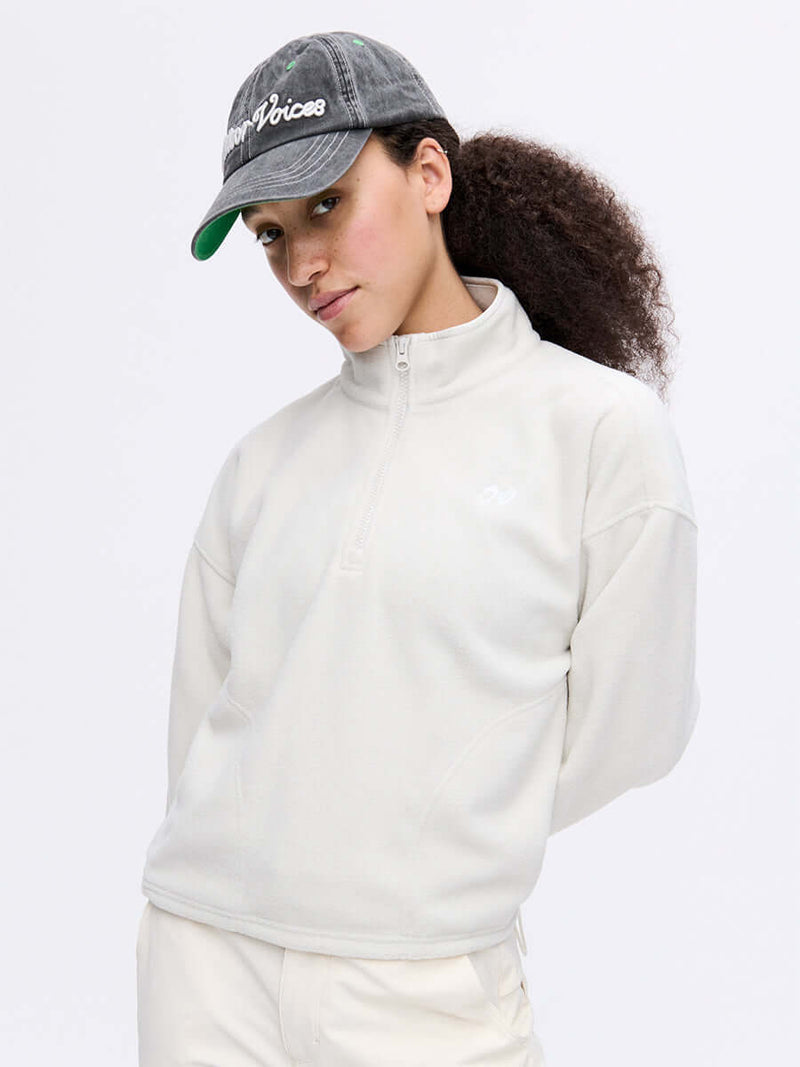 Model wearing RecFleece 1/4 Zip in light gray, featuring a front zip and soft fleece fabric.