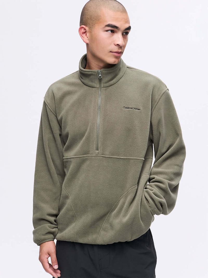 Model wearing RecFleece 1/2 Zip in Olive, showing the front half zip and relaxed fit ideal for everyday wear.