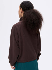 Back view of RecFleece Snap Jacket in Brown, featuring a relaxed fit and dolman sleeves.