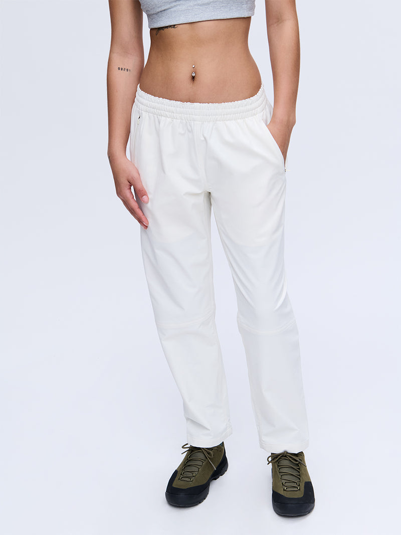 Model wearing RecTrek 26" Pant in Ivory, featuring a custom-fit drawstring and two front pockets.