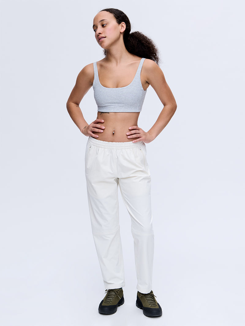 Model wearing RecTrek 26" Pant in White with custom-fit drawstring, styled for everyday activities.
