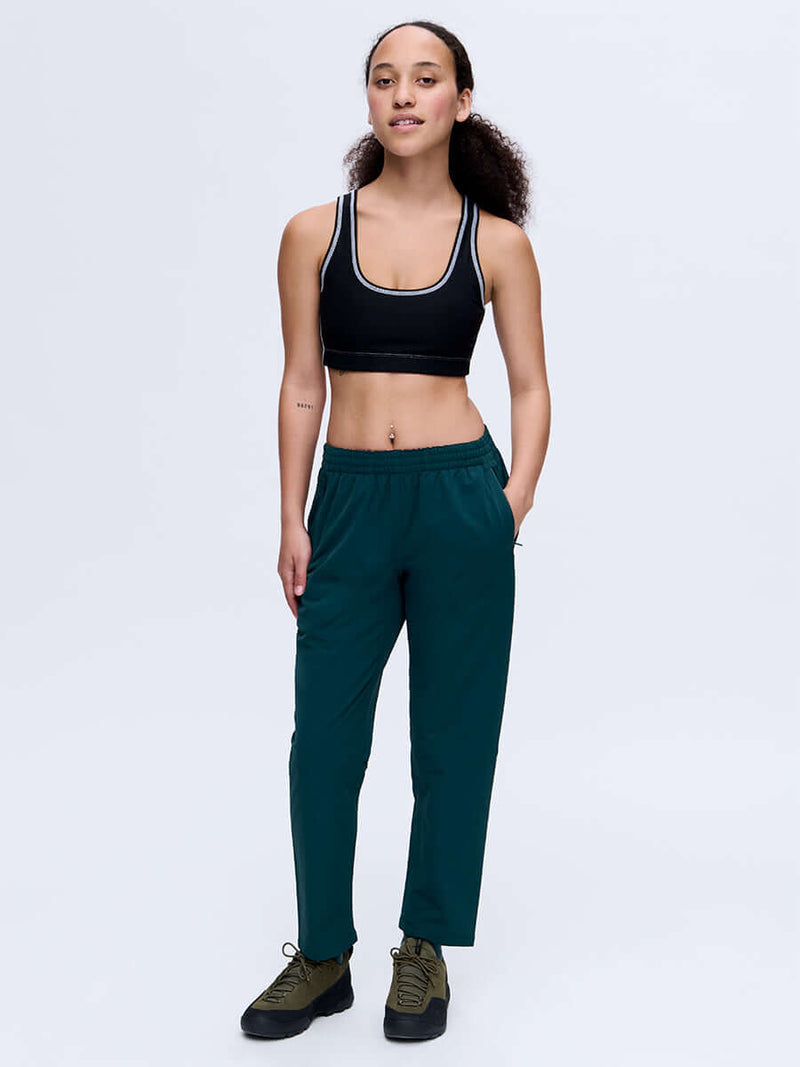 Model wearing RecTrek 26" Pant in Deep Teal with a drawstring waist, styled for everyday activewear.