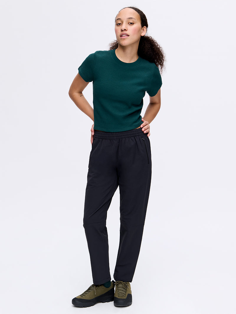 Model wearing RecTrek 26" Pant in Black with pull-on design and drawstring, ready for everyday activities.