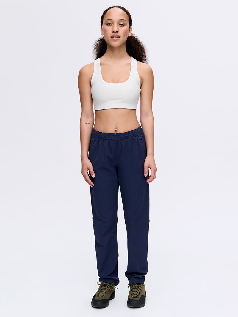 Model standing in RecTrek 29" Pant in Navy, featuring a custom-fit drawstring and relaxed fit for everyday wear.