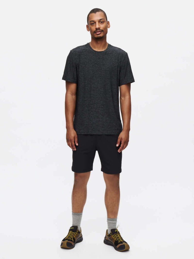 Model wearing RecTrek 7" Short in Black, with a sleek design ideal for active pursuits.