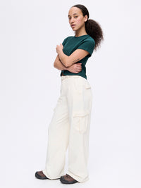 Model standing in RecTrek Cargo Pant in Cream with utility pockets and a relaxed fit, styled for everyday wear.