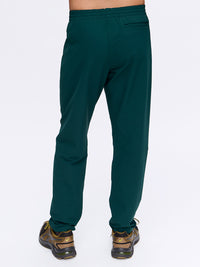 Back view of RecTrek Pant in Dark Green, featuring a relaxed fit and zippered pocket.