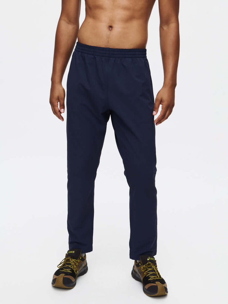 Model wearing RecTrek Pant in Navy, featuring a relaxed fit and stretchy, durable fabric.