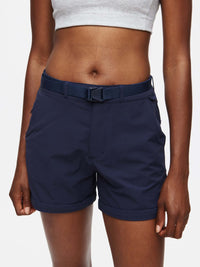 Close-up of model wearing RecTrek Zip-Off Pant in Navy with adjustable belt and relaxed fit, ideal for activewear.