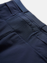 Detail shot of RecTrek Zip-Off Pant in Navy, highlighting the breathable mesh pocket and durable fabric.