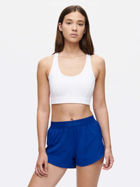 Model wearing Relay 3" Short in Blue with an elastic waistband, styled for active movement.