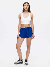 Model wearing Relay 3" Short in Blue, lightweight performance fabric for active recreation.