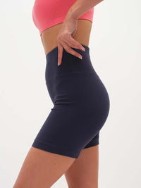 Side view of Echo 5.5" Short in Cotton Candy, featuring tall waistband and supportive stretch.