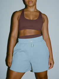 Model wearing Sport Short in Sky Blue with an adjustable waistband and comfortable fit, styled for everyday wear.