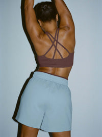 Back view of Sport Short in light blue, featuring a comfortable nylon waistband and supportive fit.