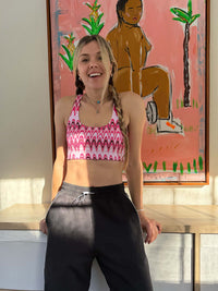 Model smiling in Sport Sweatpant, featuring a clean nylon waistband for comfort.