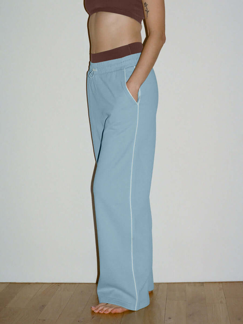 Side view of Sport Sweatpant in Light Blue, featuring a comfortable nylon waistband and pockets.