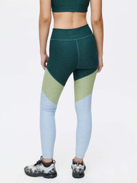 Back view of Springs 7/8 Legging in Green and Blue, designed with 3-tone paneling for a sculpted fit.
