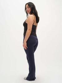Side view of model wearing Strappy Tank in Cotton Candy, featuring adjustable spaghetti straps and a soft fit.