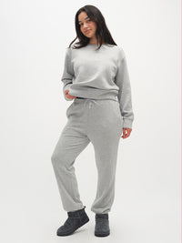 Model posing in Stratus Sweatpant in Gray, with a relaxed silhouette and ultra-soft fabric.