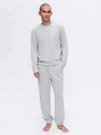 Model standing in Stratus Sweatpant in Light Gray, with ultra-soft heavyweight fabric and relaxed silhouette.