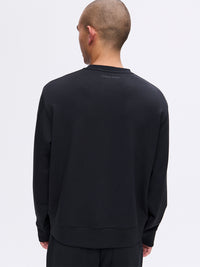 Back view of Stratus Sweatshirt in Black, with its heavyweight and ultra-soft fabric for cooler weather.