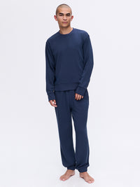 Model standing in Stratus Sweatshirt in Navy, heavyweight and ultra-soft for cool weather comfort.
