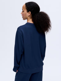Back view of Stratus Sweatshirt in Navy, with its relaxed silhouette and cozy fit.