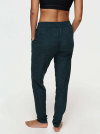 Back view of woman wearing CloudKnit Sweatpant with pockets and drawstring waistband.