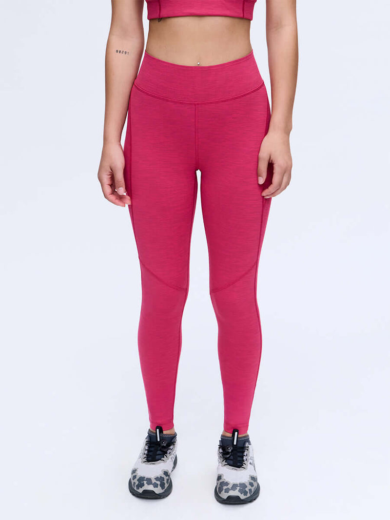 Model in a standing pose wearing TechSweat Core 7/8 Legging in Pink, designed for high-intensity activity.