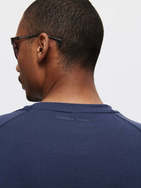 Back view of ThinkFast Mesh Shortsleeve in Navy, featuring built-in cooling technology for outdoor activities.