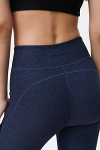 Back view of Two Tone 7/8 Legging in Navy, highlighting textured fabric and sculpting fit.
