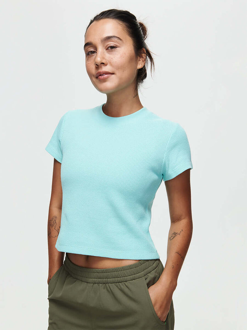 Model wearing Waffle Baby Tee in Aqua Blue, made from soft waffle knit fabric for everyday comfort.