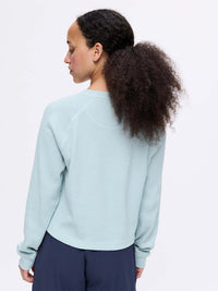 Back view of Waffle Longsleeve in Light Blue, featuring a relaxed boxy fit and soft waffle knit texture.