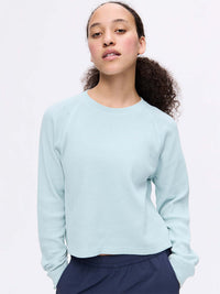 Model wearing Waffle Longsleeve in Light Blue, featuring a soft waffle knit texture and relaxed fit.