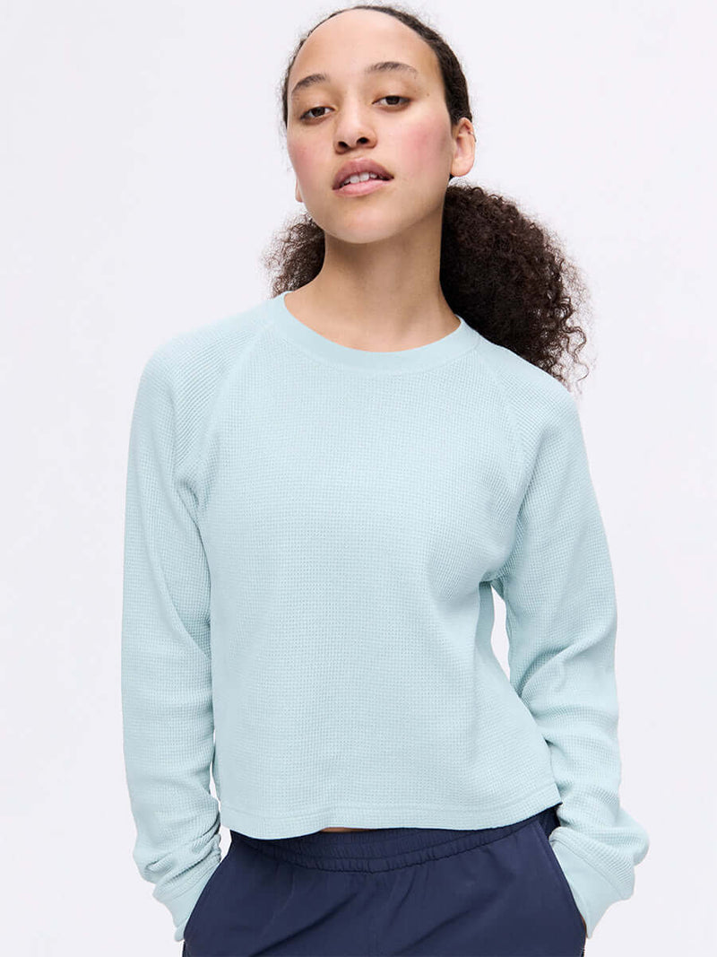 Model wearing Waffle Longsleeve in Light Blue, featuring a soft waffle knit texture and relaxed fit.