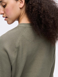 Back view of Waffle Longsleeve in Olive, showing the waffle knit texture and boxy fit.