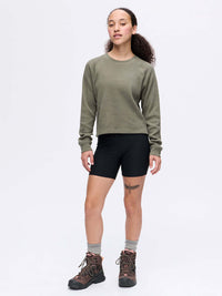 Model standing in Waffle Longsleeve in Olive, featuring a boxy fit and waffle knit texture.