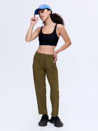 Model posing in Zephyr 26" Pant in Olive Green, featuring a custom-fit drawstring waist for active comfort.
