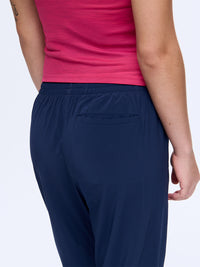 Back view of Zephyr 29" Pant in Navy, highlighting the zippered pocket and custom-fit drawstring waist.